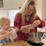 Mandy baking with her grandchild