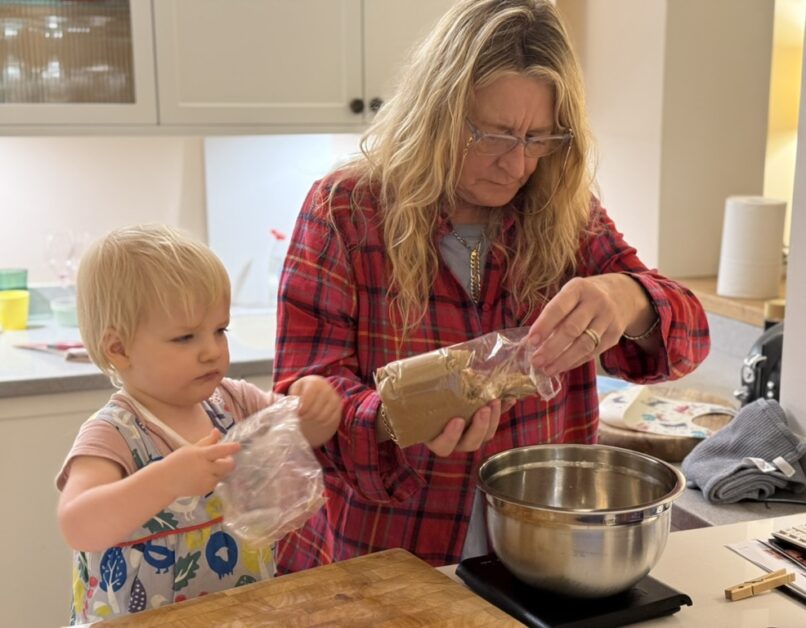 Mandy baking with her grandchild